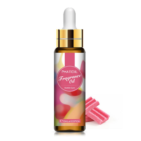 Bottle of PHATOIL fragrance oil with colorful label and pink candy on a white background