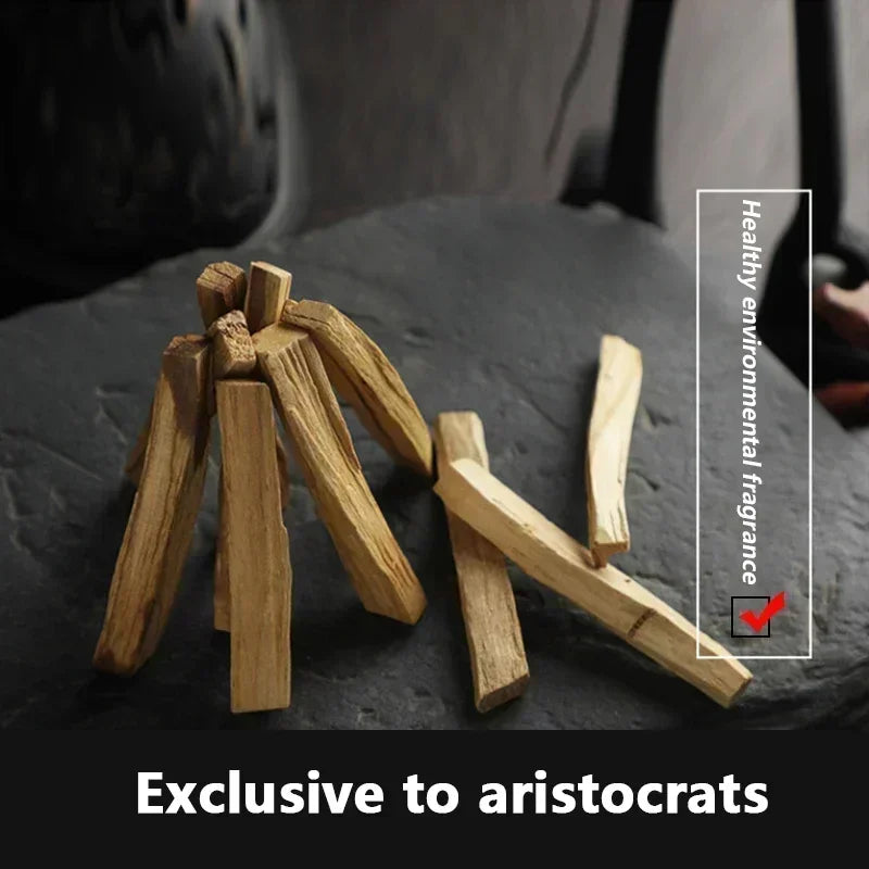 Wooden sticks on a dark surface with text about healthy environment fragrance and exclusivity to aristocrats.