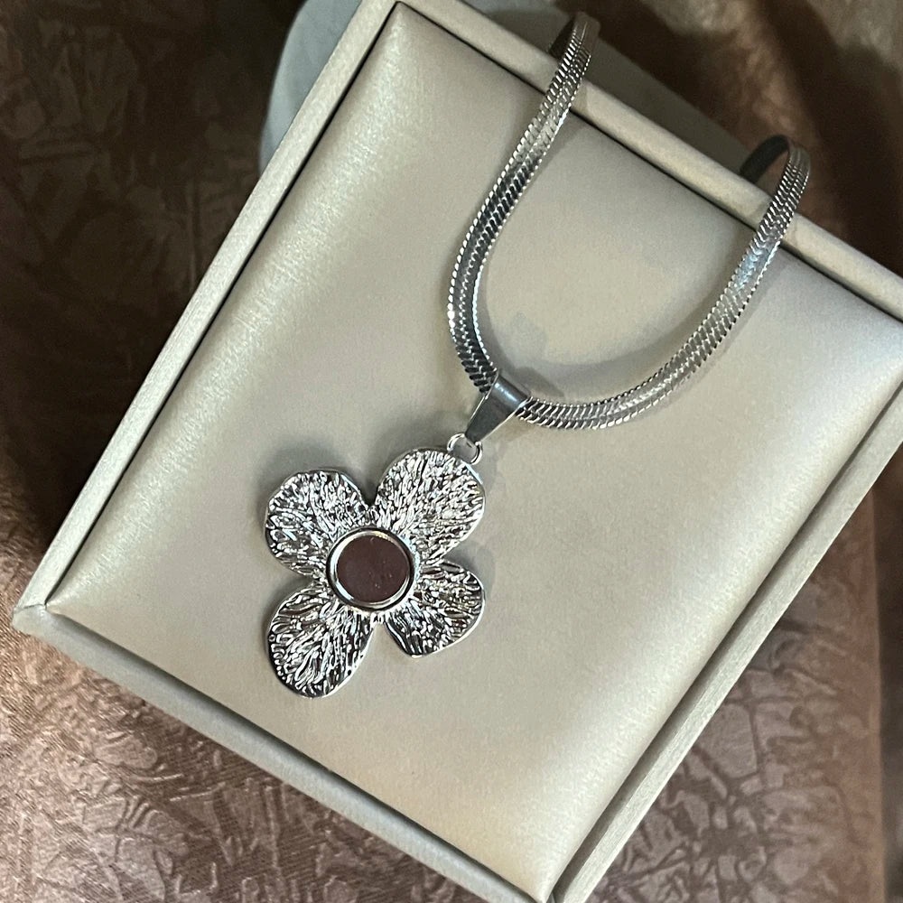 Minimalist Tree of Life necklace in stainless steel for simple everyday styling, meaningful wear, and layering.