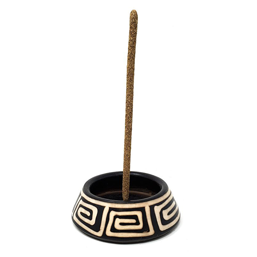 Peruvian ceramic burner side view showing hand-painted design.