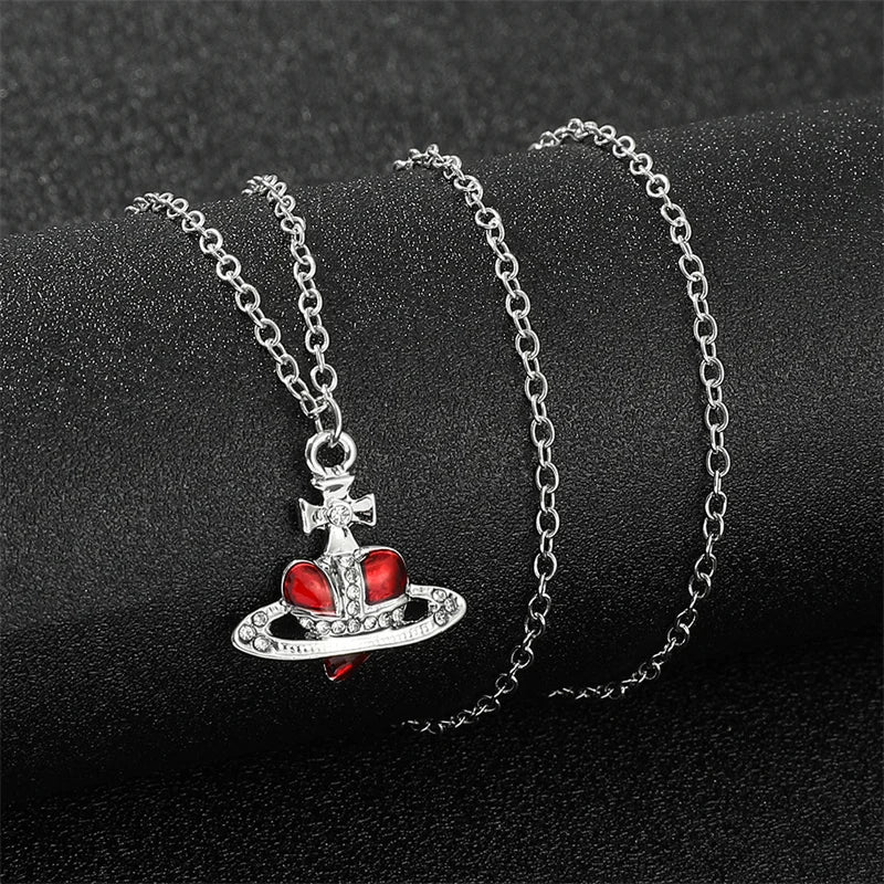 Trendy Silver Heart & Saturn Pendant necklace for cosmic-inspired fashion, casual outfits, and modern accessory styling.