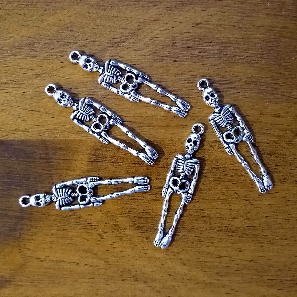 Skeleton charm for jewelry making, meditation malas, and gothic-themed accessories.