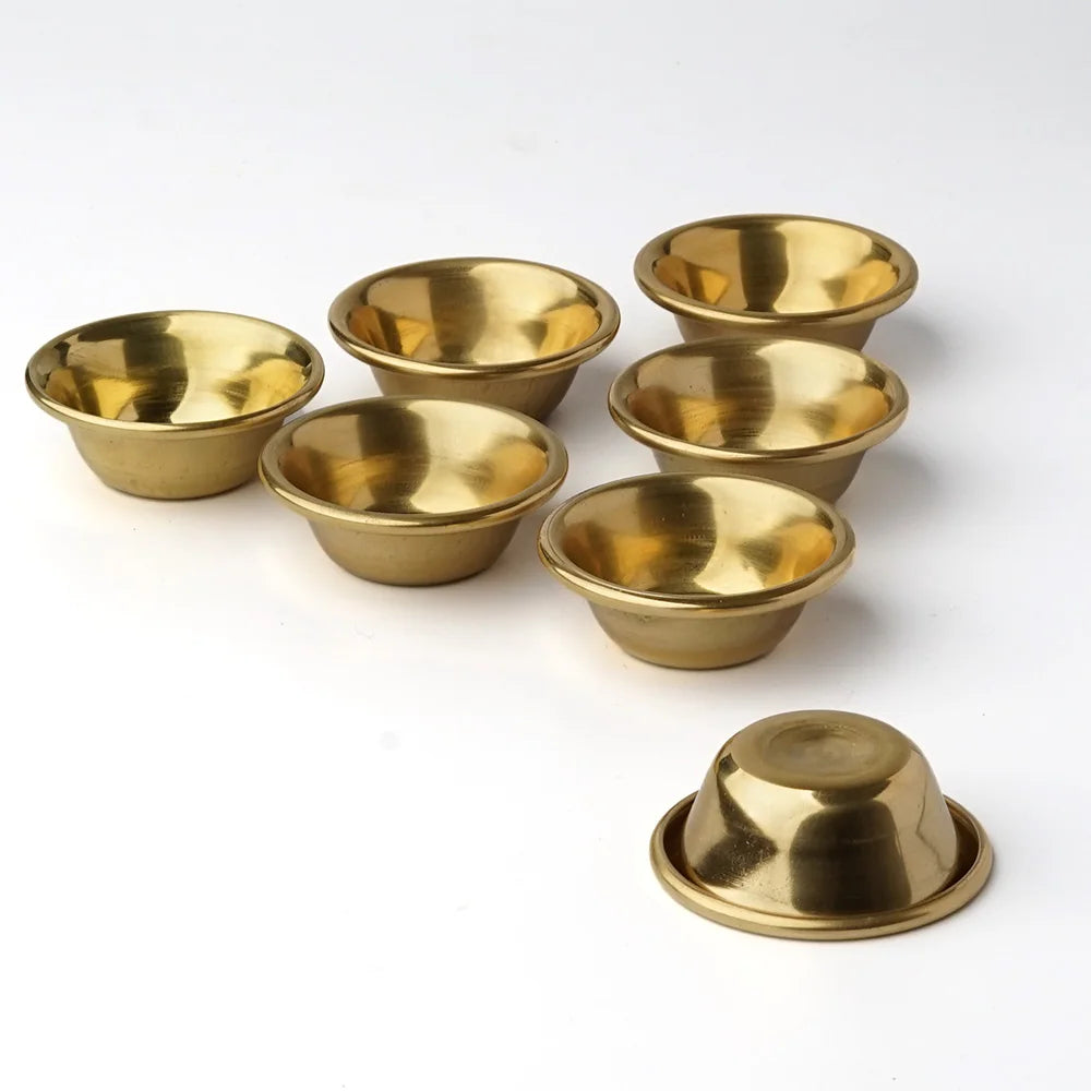 Small brass offering bowl set in Tibetan style for prayer table offerings, temple decor, and spiritual ceremonies.