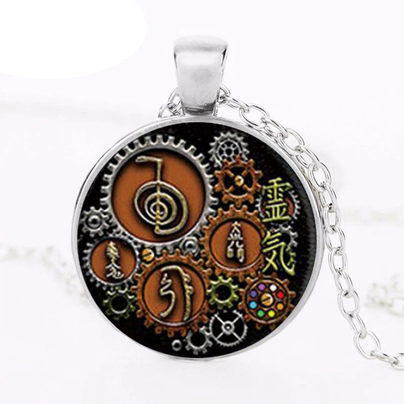 Steampunk Reiki glass cabochon pendant jewelry piece for energy healing, spiritual wear, and everyday accessory styling.