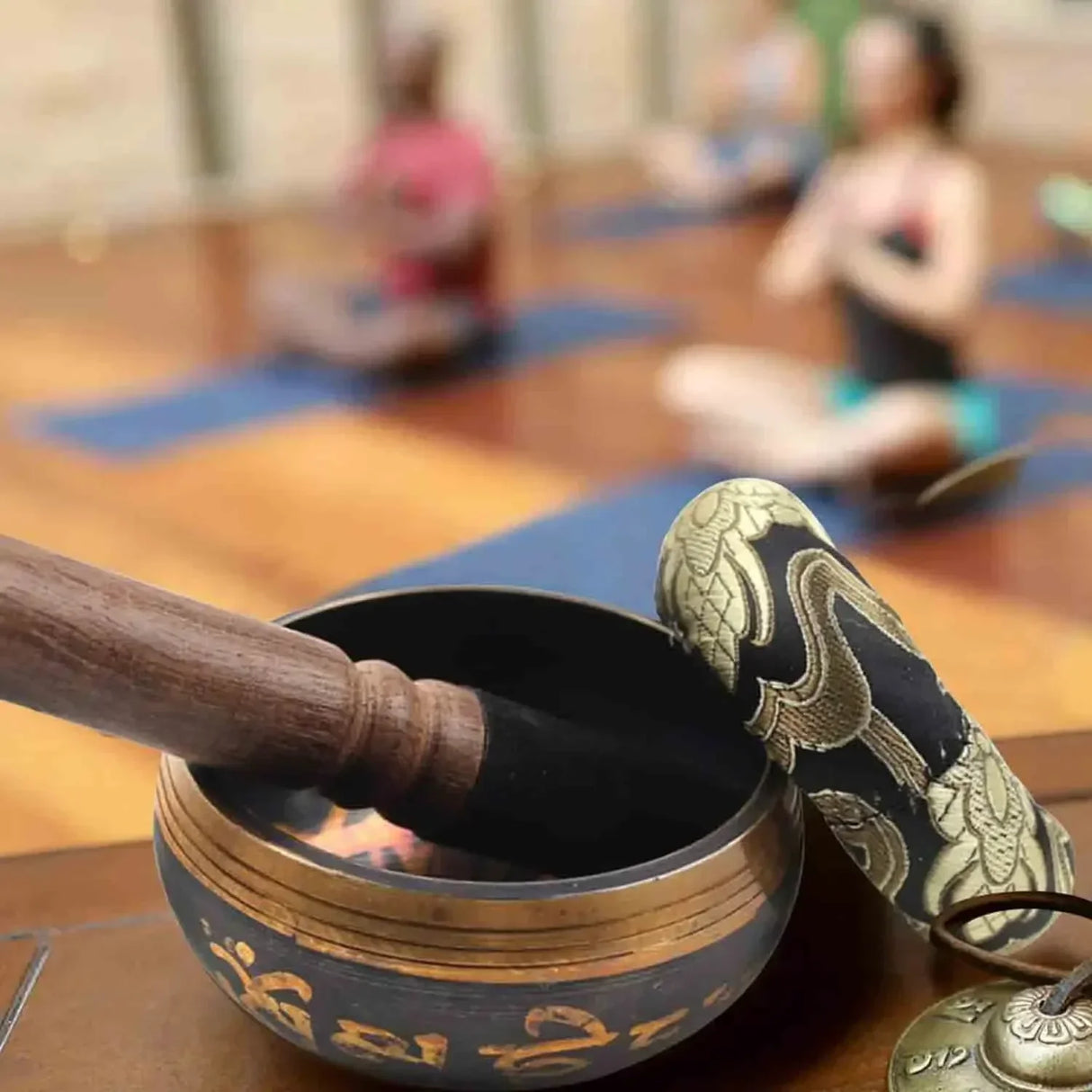Tibetan Singing Bowl 8cm metal bowl with wooden stick for yoga, relaxation, and calming ritual use.