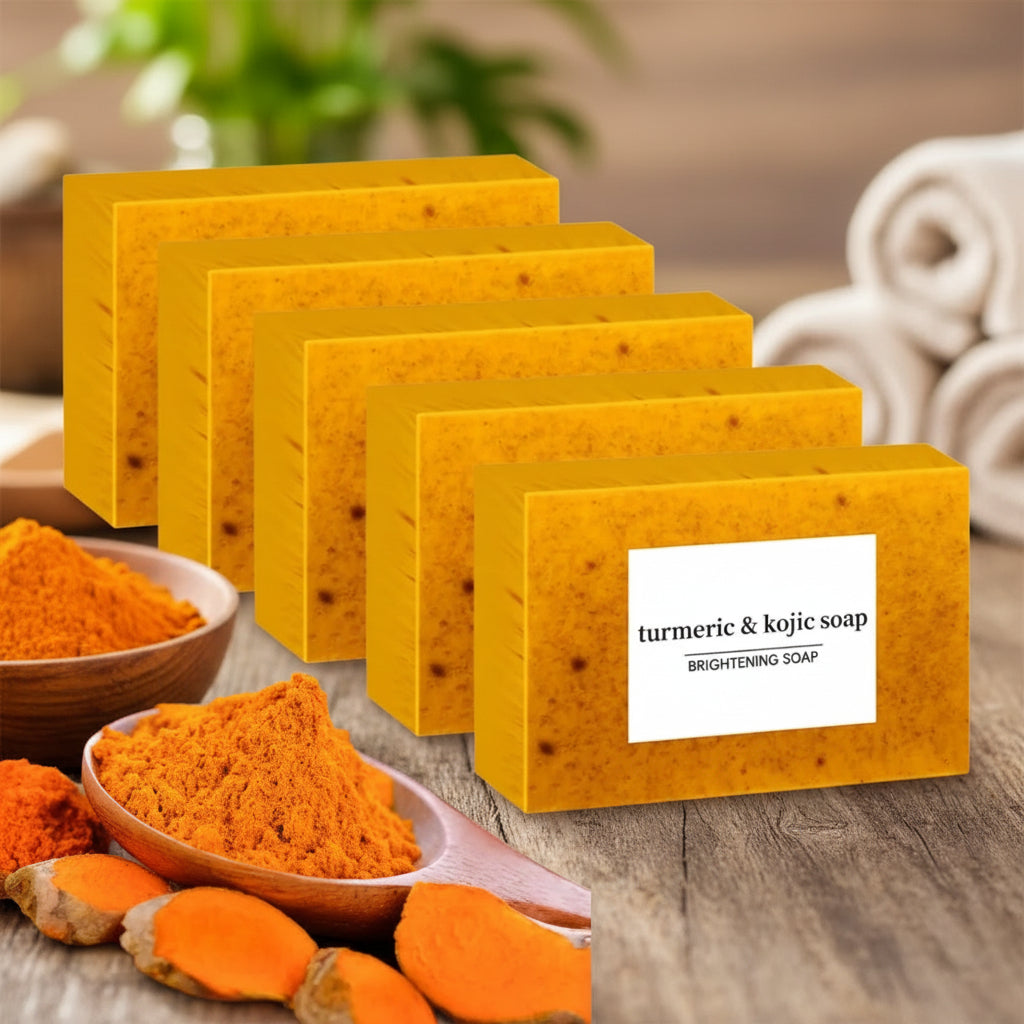 Turmeric Kojic Acid Brightening Soap bars with natural turmeric powder and roots on white background.