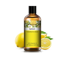 PHATOIL lemon essential oil in a 100ml amber glass bottle with a black screw cap and printed lemon label.