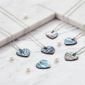 2PCS Natural Abalone Shell Heart Pendants charms for jewelry making, necklace crafting, and bracelet design.