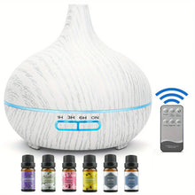 550ML mist diffuser with USB connection and 6 aroma oil bottles for humidifying small spaces, freshening rooms, and aromatherapy use.