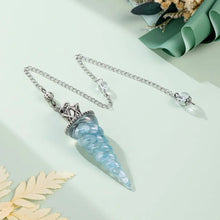 7-Chakra Aquamarine pendulum in resin form for reiki sessions, spiritual focus, and healing rituals.