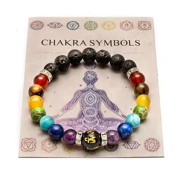 7 Chakra Healing Bracelet with chakra-colored beads presented on a meaning card showing all 7 chakra symbols.