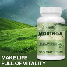 Moringa supplement bottle with green field background