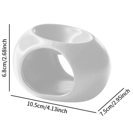 White plastic ring with dimensions labeled on a white background
