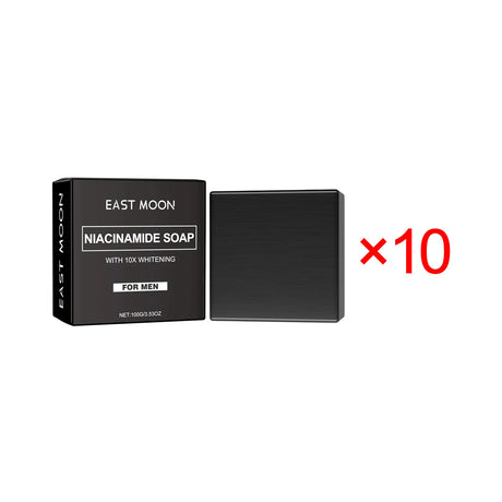Black soap bar and packaging with 'East Moon' branding on a white background