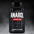 Black supplement bottle labeled 'Anabol Hardcore' on a dark background