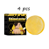 Yellow soap bar next to its packaging labeled 'ShineLuster' on a white background