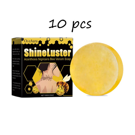Yellow soap bar next to its packaging labeled 'ShineLuster' on a white background