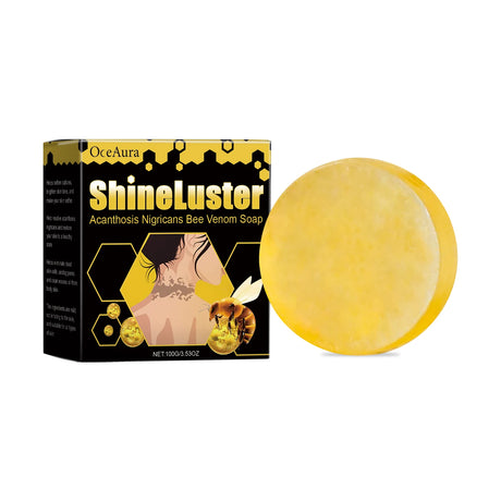 Yellow soap bar next to its packaging labeled 'ShineLuster' on a white background
