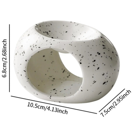 Speckled ceramic ring with measurements on a white background