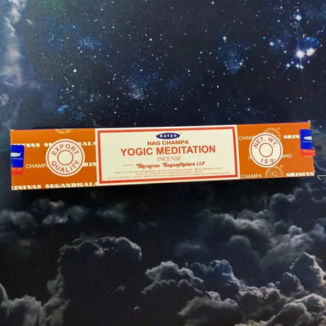 Box of Nag Champa Yogic Meditation incense against a cosmic background