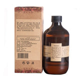 Brown bottle with label and cardboard box on a white background