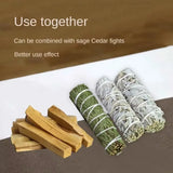 Bundles of sage and cedar sticks on a white surface with text about their use.
