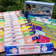 Collection of Satya Nag Champa incense boxes in various colors and designs.