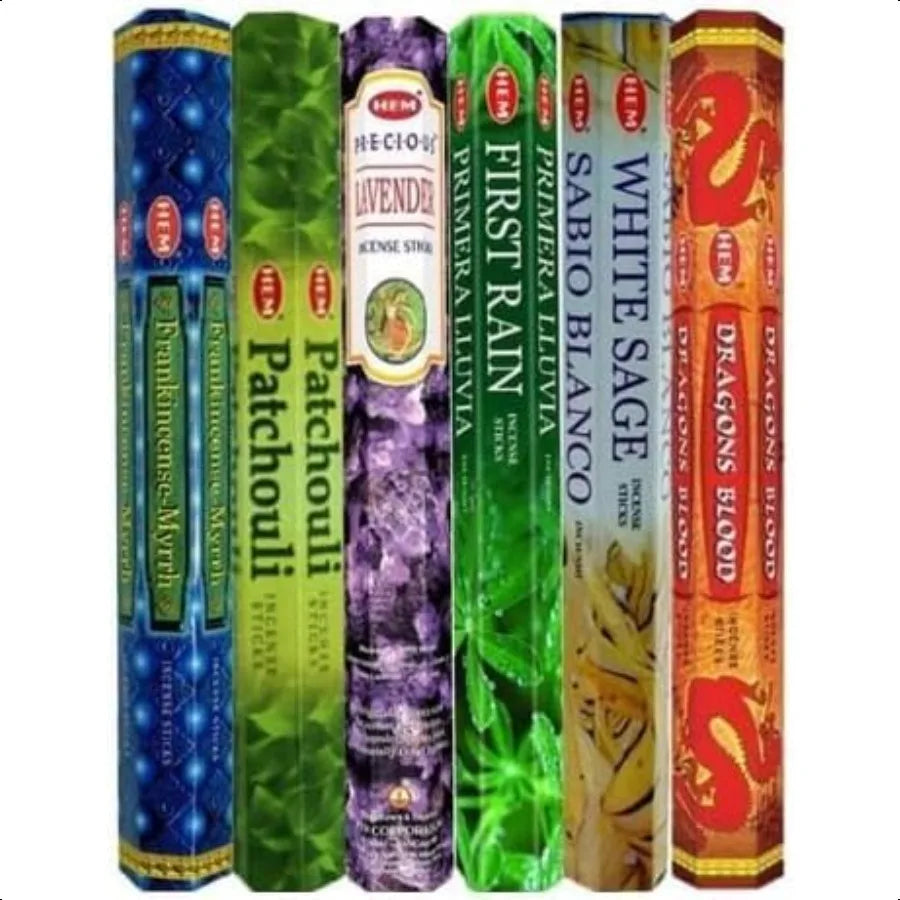 Collection of incense sticks in various packaging on a white background
