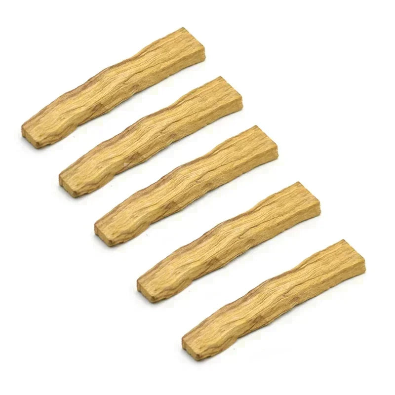 Five pieces of dried vanilla wood stick on a white background