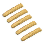 Five pieces of dried yellow sticks on a white background
