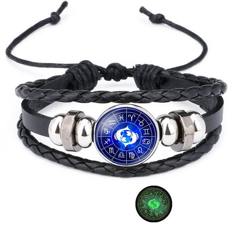 Black braided leather bracelet with a blue circular pendant featuring symbols, on a white background.