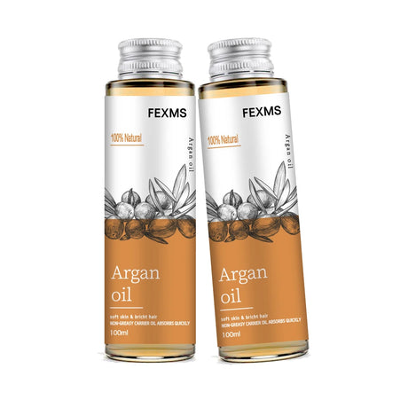 Two bottles of FEXMS Argan oil on a white background