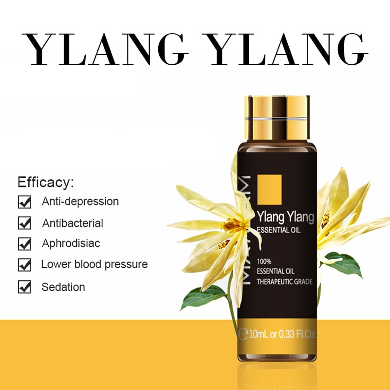 Ylang Ylang essential oil bottle with flowers on a white background