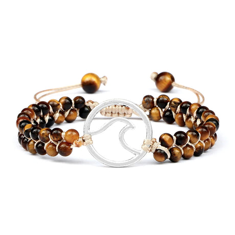 Set of beaded bracelets with a silver circular charm on a white background