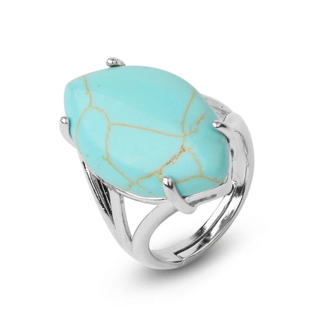 Turquoise ring with silver band on a white background