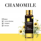 Mayuam Chamomile essential oil bottle with flowers on a white background