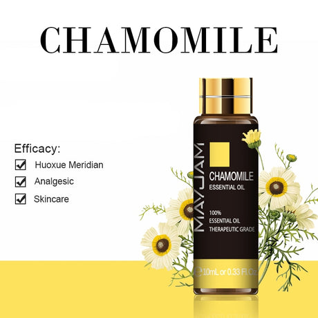 Mayuam Chamomile essential oil bottle with flowers on a white background