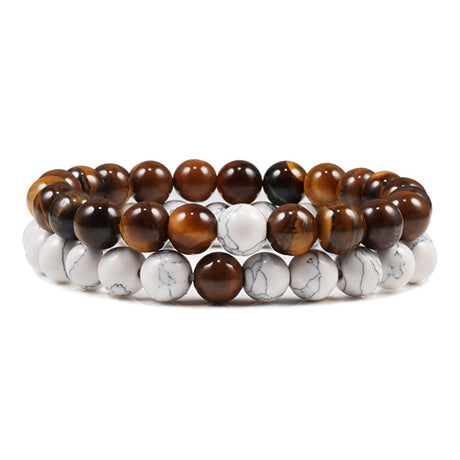 Two beaded bracelets with brown and white beads on a white background