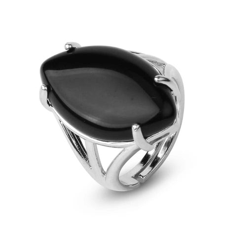 Silver ring with a large black stone on a white background