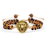 Bracelet with lion head charm and beaded design on a white background