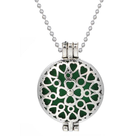 Necklace with a green heart-patterned pendant on a white background