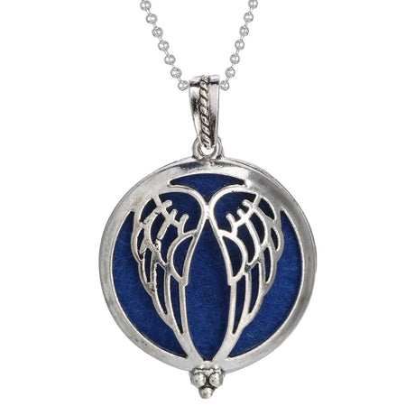 Silver pendant with wings on a blue background, attached to a chain on a white background