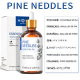 Bottle of pine needles essential oil with packaging and multilingual labels.