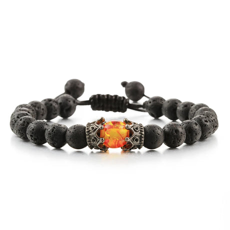 Bracelet with black beads and a central orange gemstone on a white background