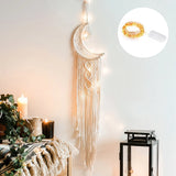 Decorative wall hanging with moon design and LED string lights on a neutral background.
