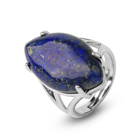 Silver ring with a large blue stone on a white background