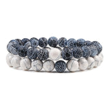 Set of three bracelets with blue and white marbled pattern on a white background