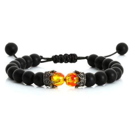 Black beaded bracelet with fiery red and yellow beads on a white background