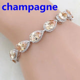 Bracelet with champagne-colored gemstones on a wrist, labeled 'champagne'.