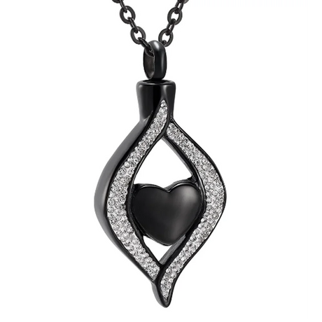 Black heart-shaped pendant with silver accents on a white background